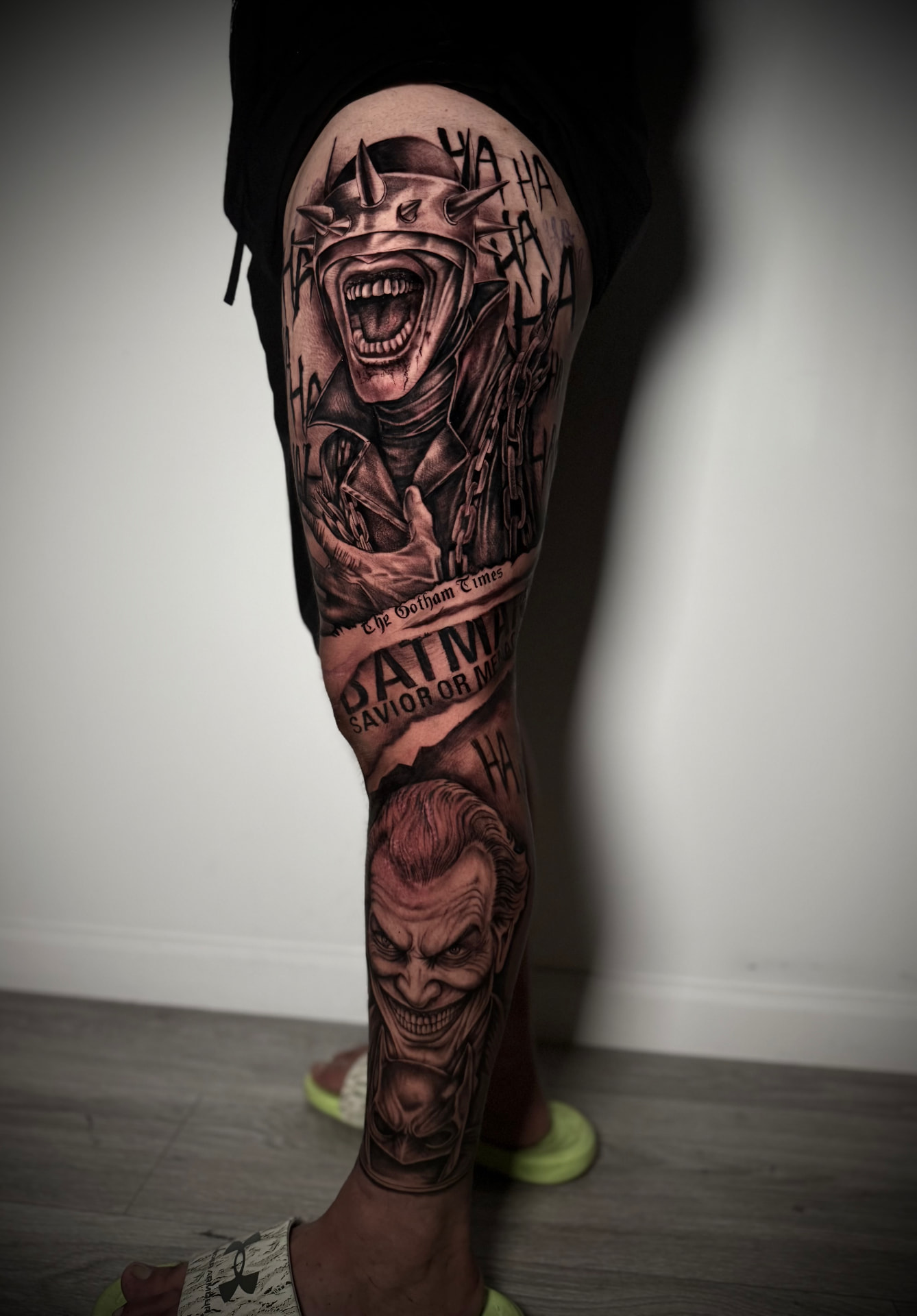 Black and grey Joker leg sleeve tattoo